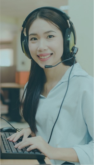 smiling lady with headset typing
